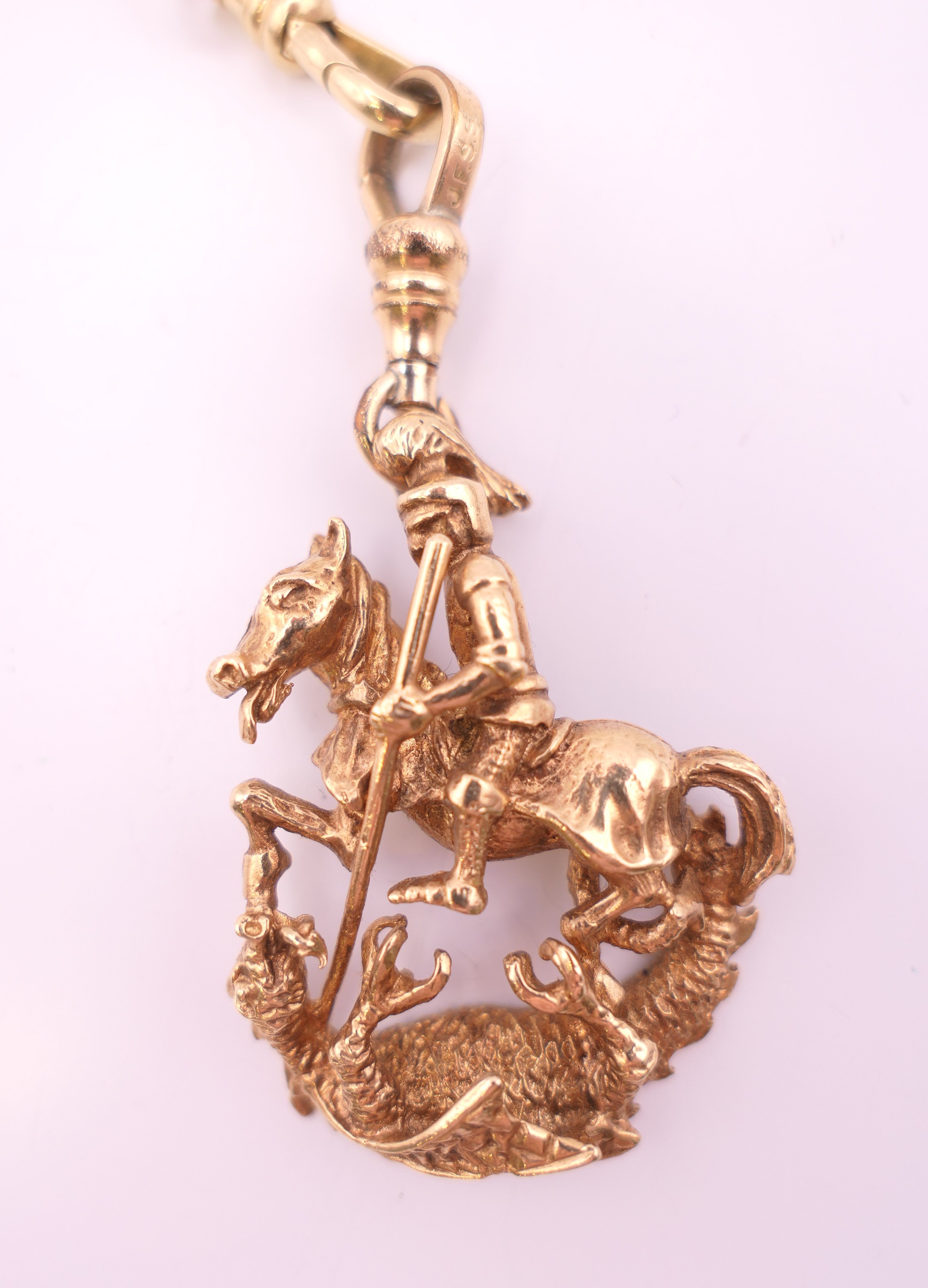 A 9 ct gold watch chain and 9 ct gold fob pendant of Saint George slaying the dragon. - Image 2 of 8