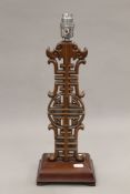 A vintage Chinese wooden table lamp. 43 cm high.