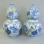 A pair of large Chinese blue and white double gourd porcelain vases. 62 cm high.