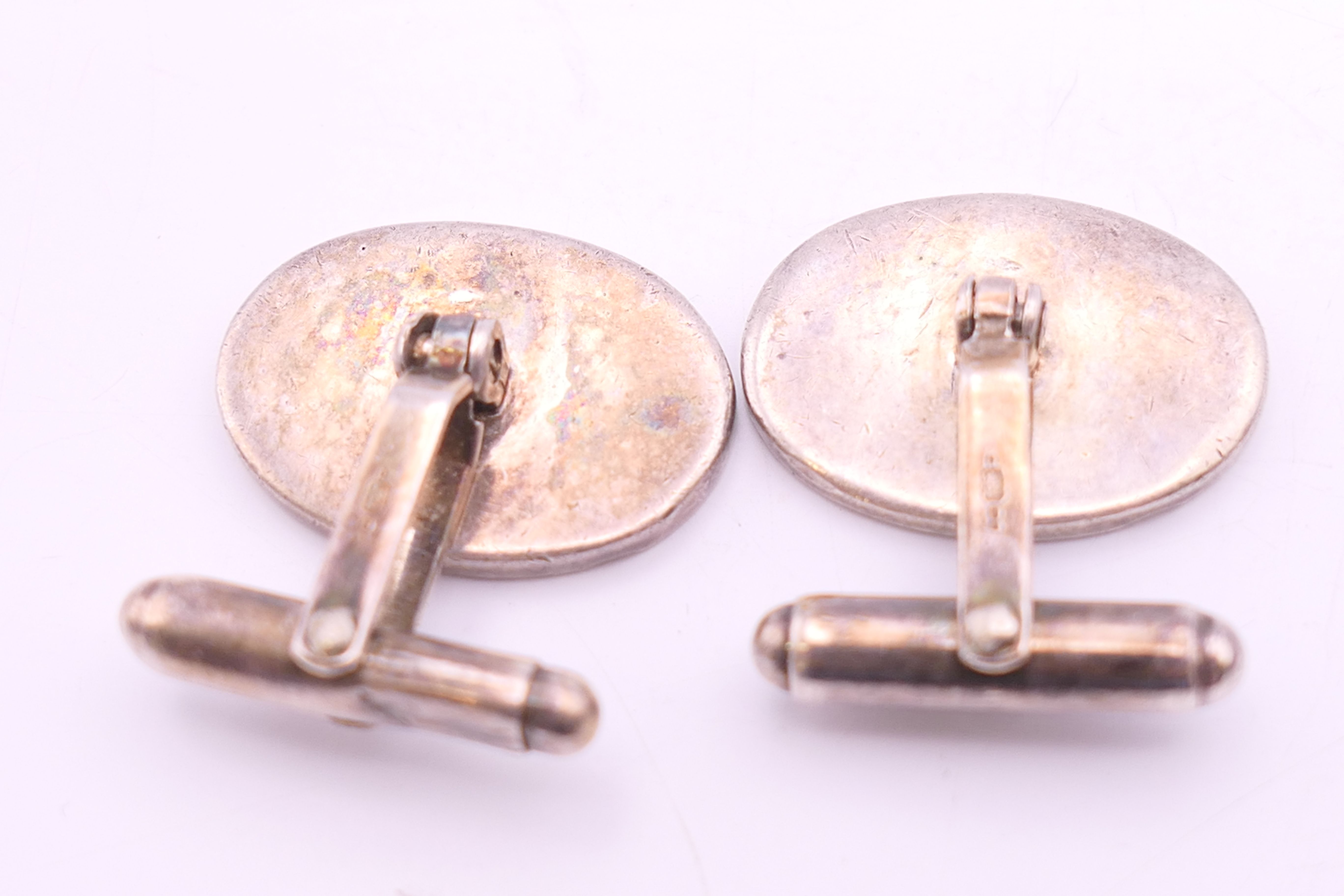 A pair of silver hallmarked cufflinks and a pair of red enamel cufflinks. - Image 3 of 6