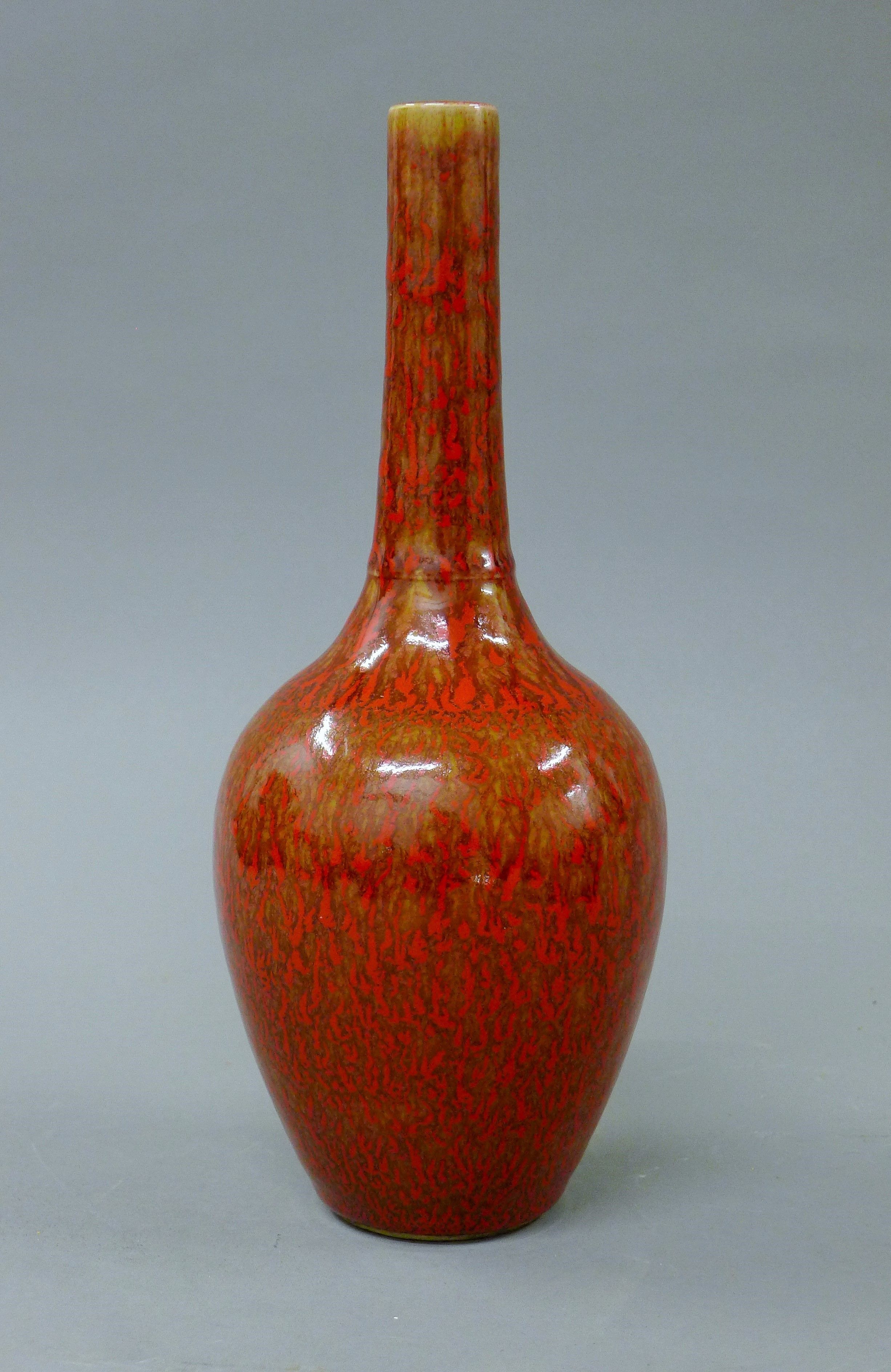A Chinese porcelain red speckled vase. 28.5 cm high.