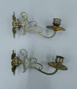 A pair of brass candle sconces. 19 cm long.