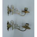 A pair of brass candle sconces. 19 cm long.