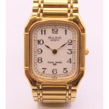 A Bulova gold plated stainless steel Super Seville quartz bracelet watch,