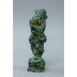 A jade model of a deity. 19.5 cm high.
