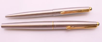 Two Parker pens in a leather case: one a fountain pen, the other a ballpoint pen.