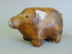 A leather pig form doorstop. 35 cm long.