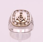 A silver Masonic ring. Ring size R.