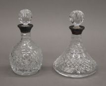 Two silver coloured cut glass decanters. The largest 18 cm high.