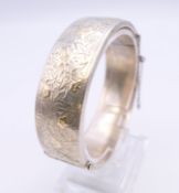 A silver bracelet. 6 cm internal diameter.