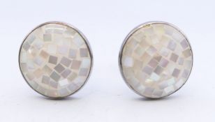 A cased pair of sterling silver and mother-of-pearl cufflinks. 1.5 cm diameter.