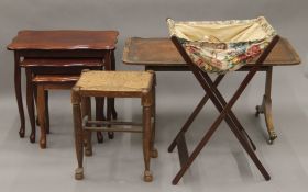 A leather top coffee table, a modern nest of three tables, a sewing bag and a stool.