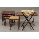 A leather top coffee table, a modern nest of three tables, a sewing bag and a stool.