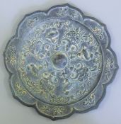 A 19th century Chinese bronze mirror. 21 cm diameter.