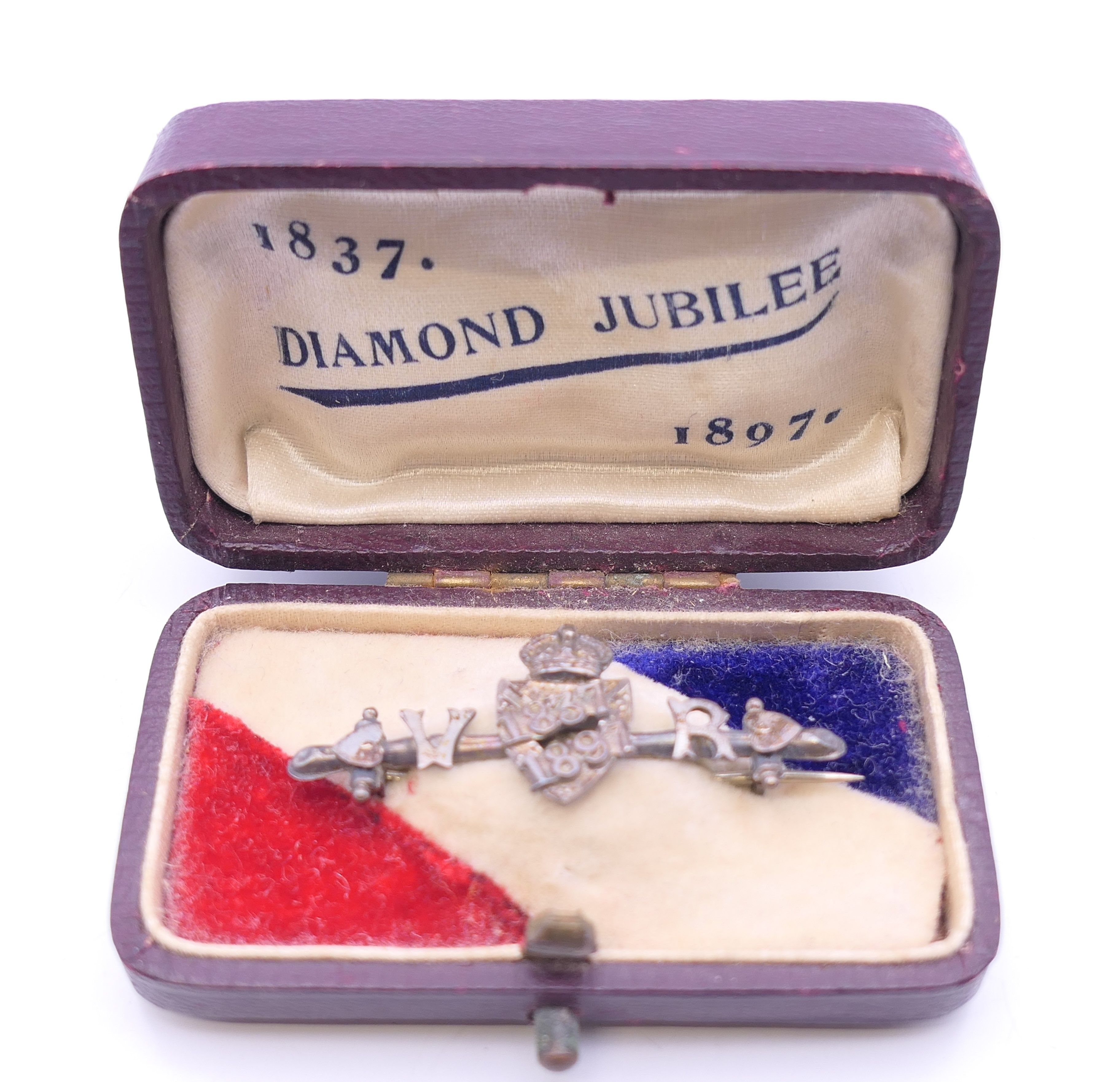 A Victorian 1837-1897 Jubilee brooch, in original box. 4 cm long.