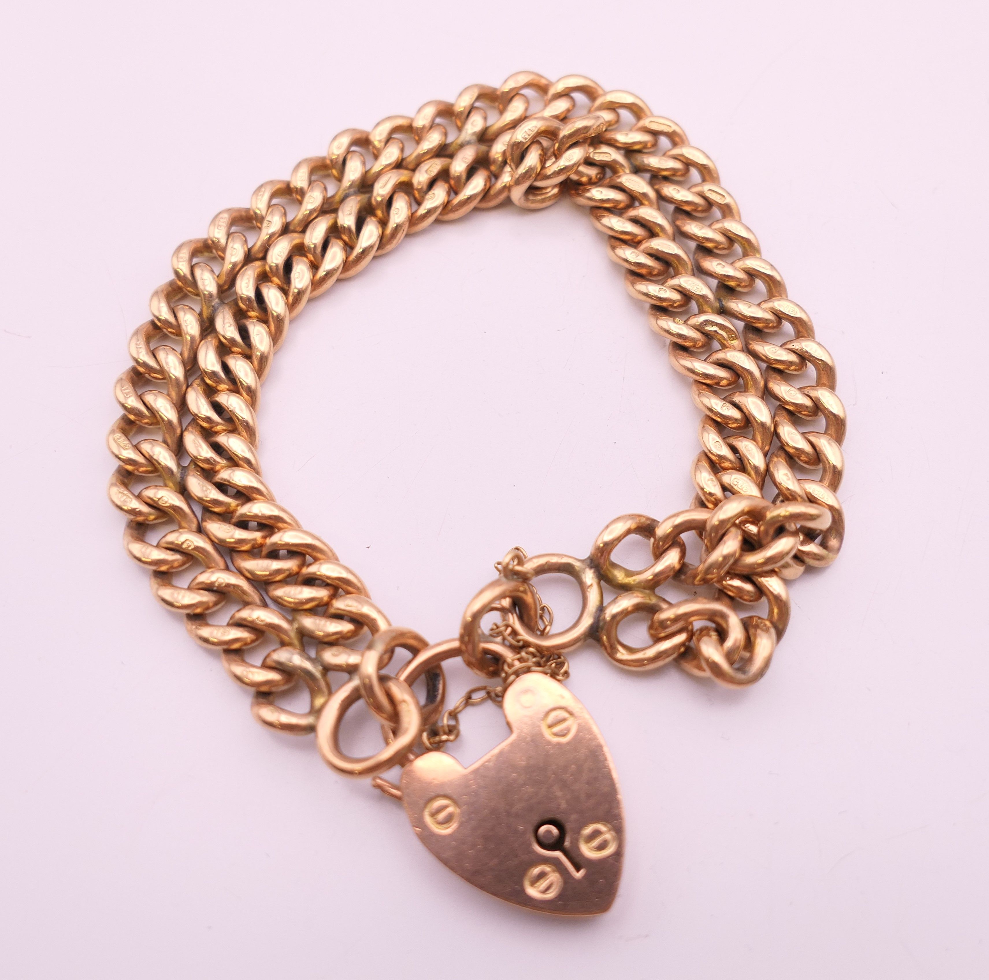 A 9 ct gold bracelet and charms. Bracelet 18 cm long. 58.6 grammes. - Image 2 of 17