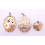 Three various lockets. Largest 3.25 cm high.