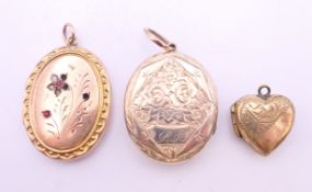 Three various lockets. Largest 3.25 cm high.