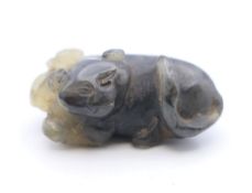 A Chinese jade netsuke of two dogs-of-fo. 4.5 cm long.