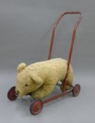 A Chiltern push-along teddy bear. 52 cm long.