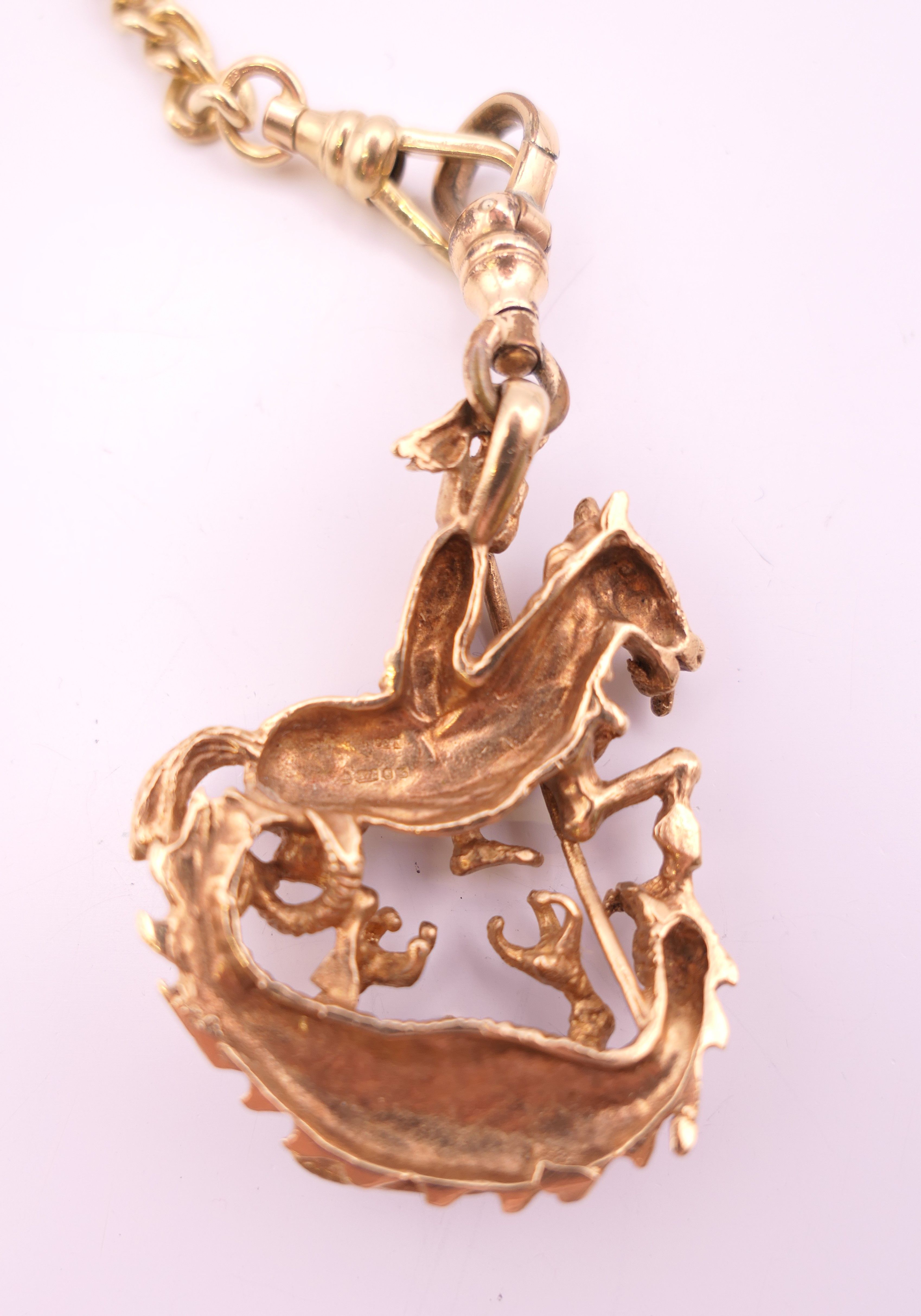 A 9 ct gold watch chain and 9 ct gold fob pendant of Saint George slaying the dragon. - Image 3 of 8