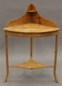 A 19th century pine corner washstand. 69 cm wide.