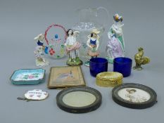A quantity of miscellaneous items, including porcelain figures, a pair of brass photograph frames,
