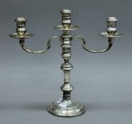 A silver candelabra. 30 cm high. 807.5 grammes loaded.