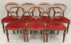 A set of seven Victorian style mahogany dining chairs and a Regency style mahogany pedestal dining