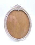 A silver oval photograph frame, bearing Russian marks. 12.5 cm high.