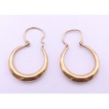A pair of 9 ct gold earrings. 2.5 cm high. 1.2 grammes.