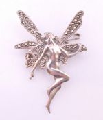 A silver fairy form brooch. 5 cm high.