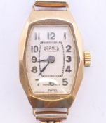 A 9 ct gold cased Roamer ladies wristwatch on a 9 ct gold strap. 13.7 grammes total weight.