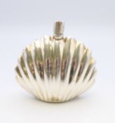 A silver shell form perfume bottle. 6 cm high.