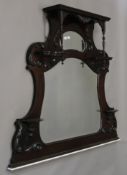 A late Victorian mahogany over mantle mirror. 125 cm wide.