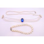 Three pearl bead necklaces. Blue stone choker necklace 43 cm long including chain links.