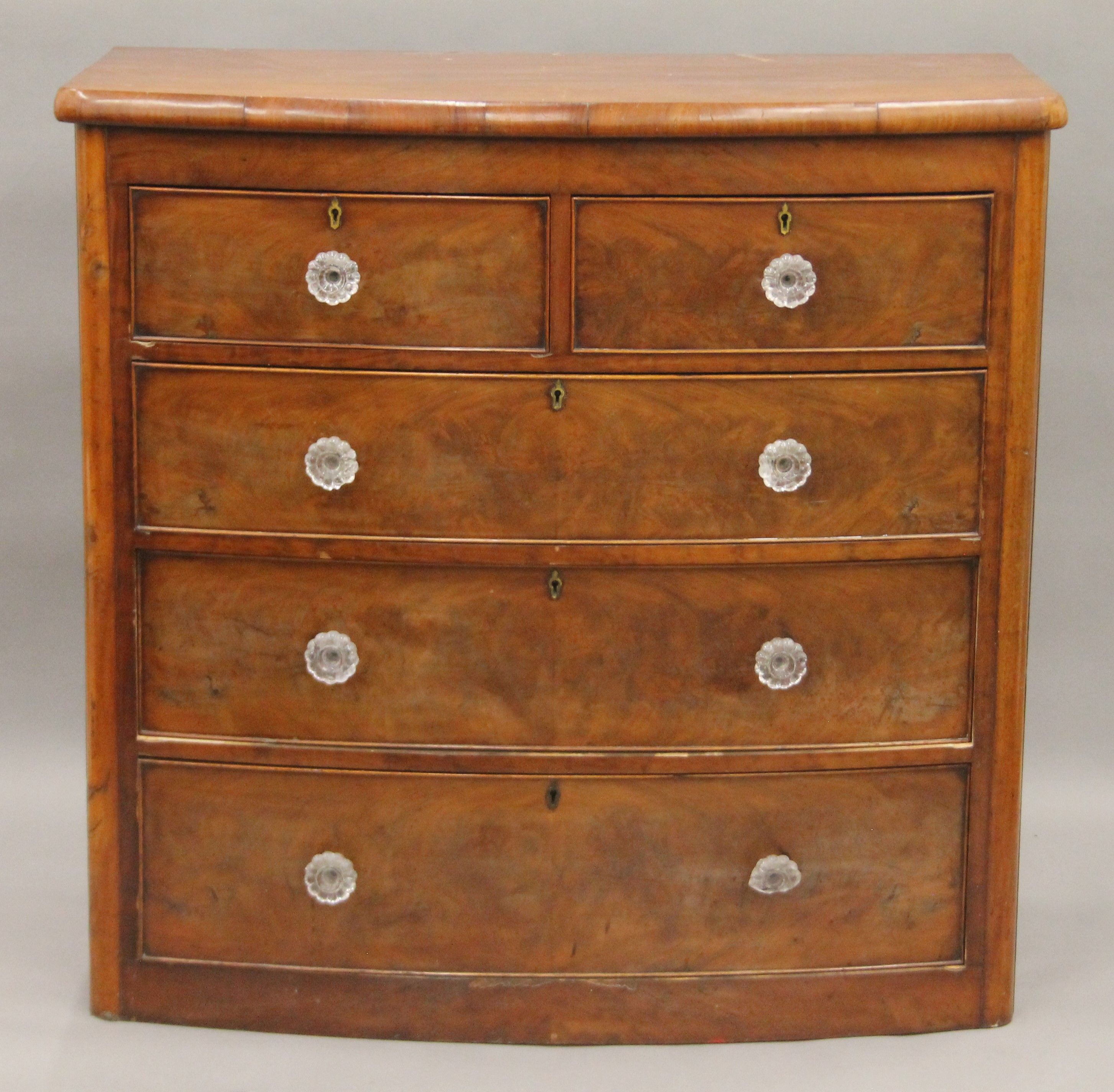 A Victorian mahogany bow front chest of drawers.