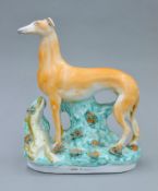 A 19th century Staffordshire pottery model of a coursing greyhound,