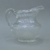 An early 19th century cut clear glass water jug, probably Irish. 17.5 cm high.