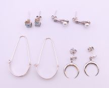 Four pairs of silver earrings. Largest 4 cm high.