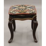 A Victorian rosewood framed stool with tapestry covered seat. 35 cm wide, 44 cm high.