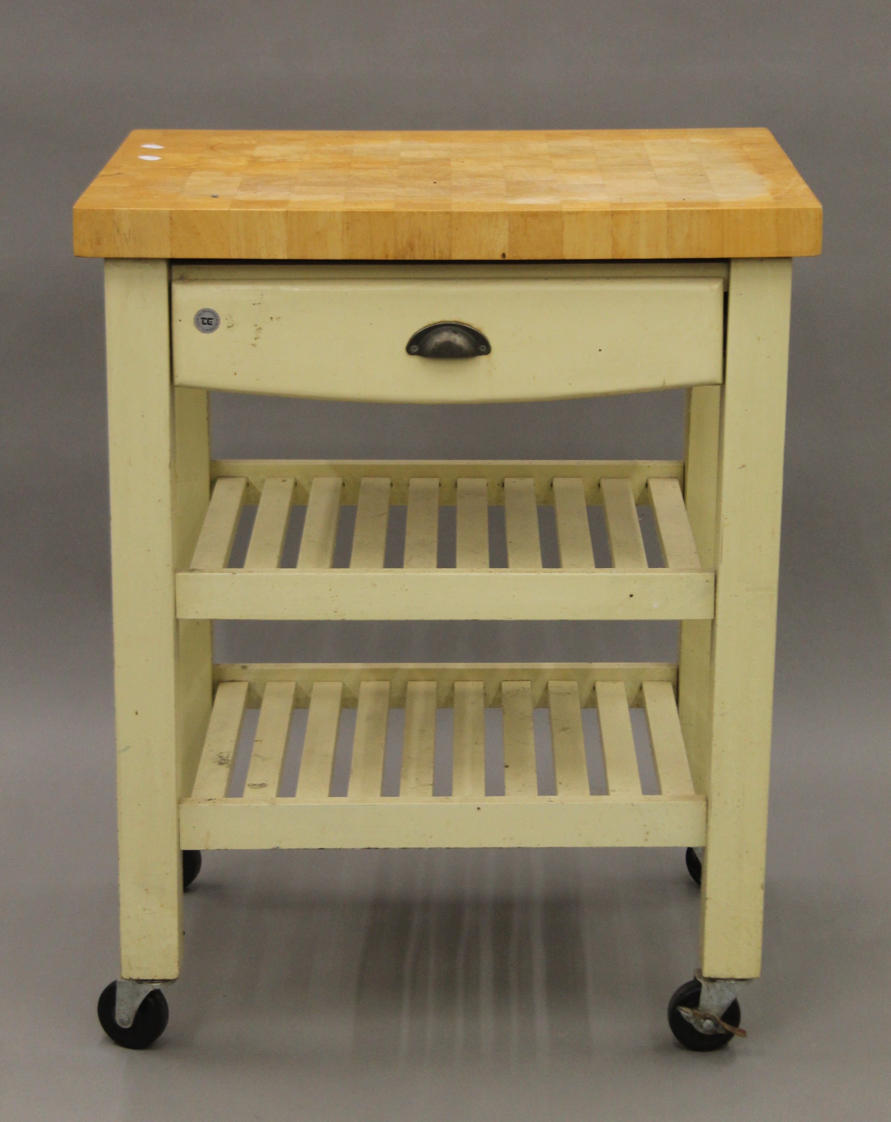 A T & G Woodware of Bristol kitchen butcher's block on wheels. 71 x 50 cm.