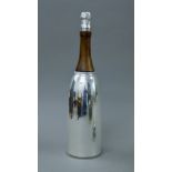 A silver plated cocktail set formed as a champagne bottle. 37 cm high.