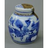 A Chinese blue and white porcelain tea jar. 11 cm high.