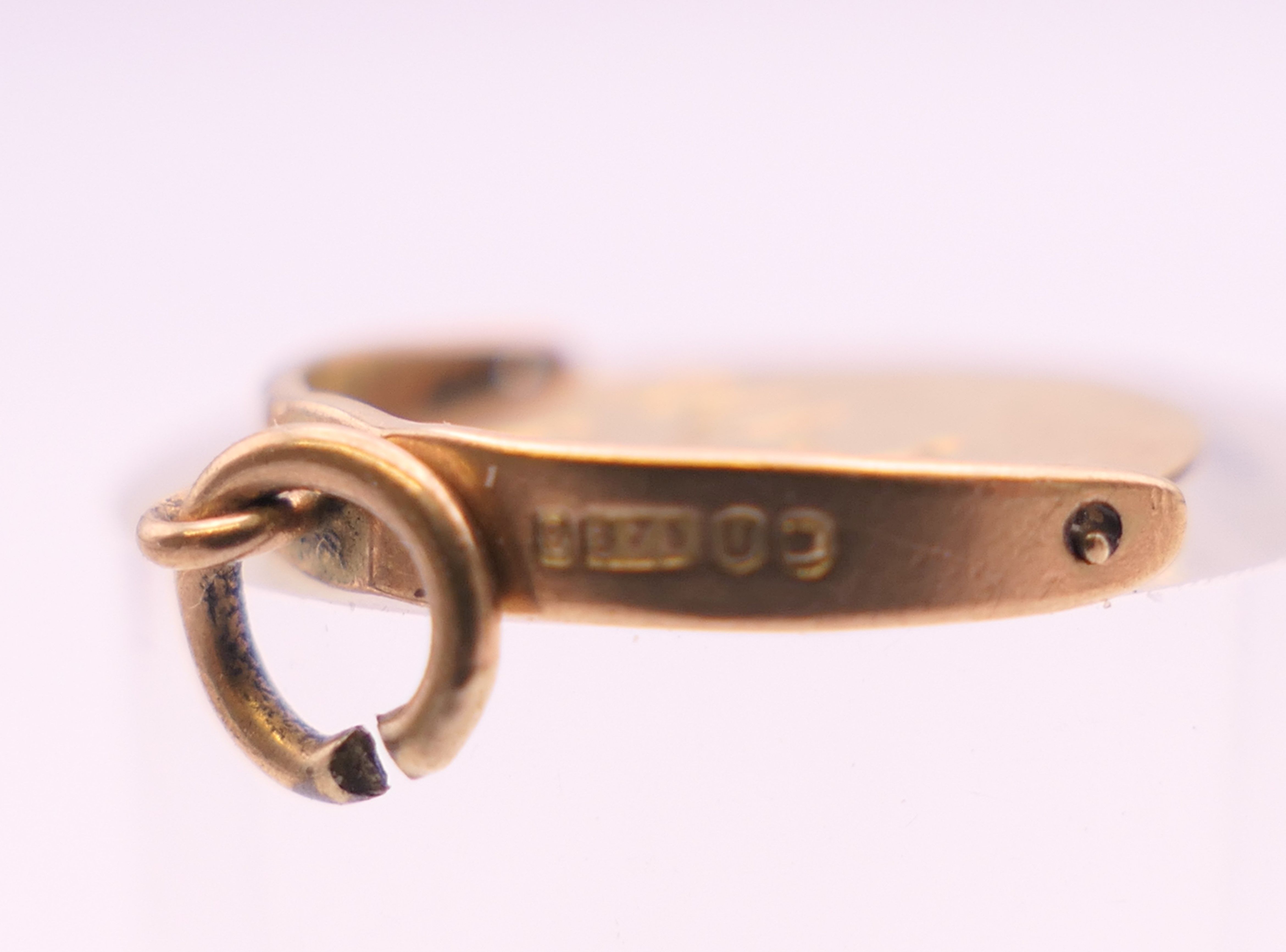 A 9 ct gold bracelet and charms. Bracelet 18 cm long. 58.6 grammes. - Image 12 of 17