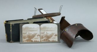 A stereo viewer, with a box of military in India stereo views.