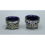 Two pierced silver salts. 6 cm diameter. 74.9 grammes.