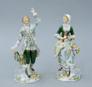 An early 20th century pair of Sitzendorf porcelain figures of a shepherd and shepherdess.