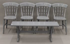 A set of four grey painted kitchen chairs and a grey painted stool.