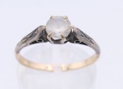 A 9 ct gold and silver ring. Ring size P. 1.7 grammes total weight.